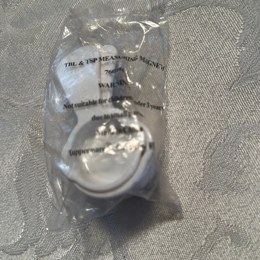 Miniature Tupperware tablespoon and teaspoon measuring magnets